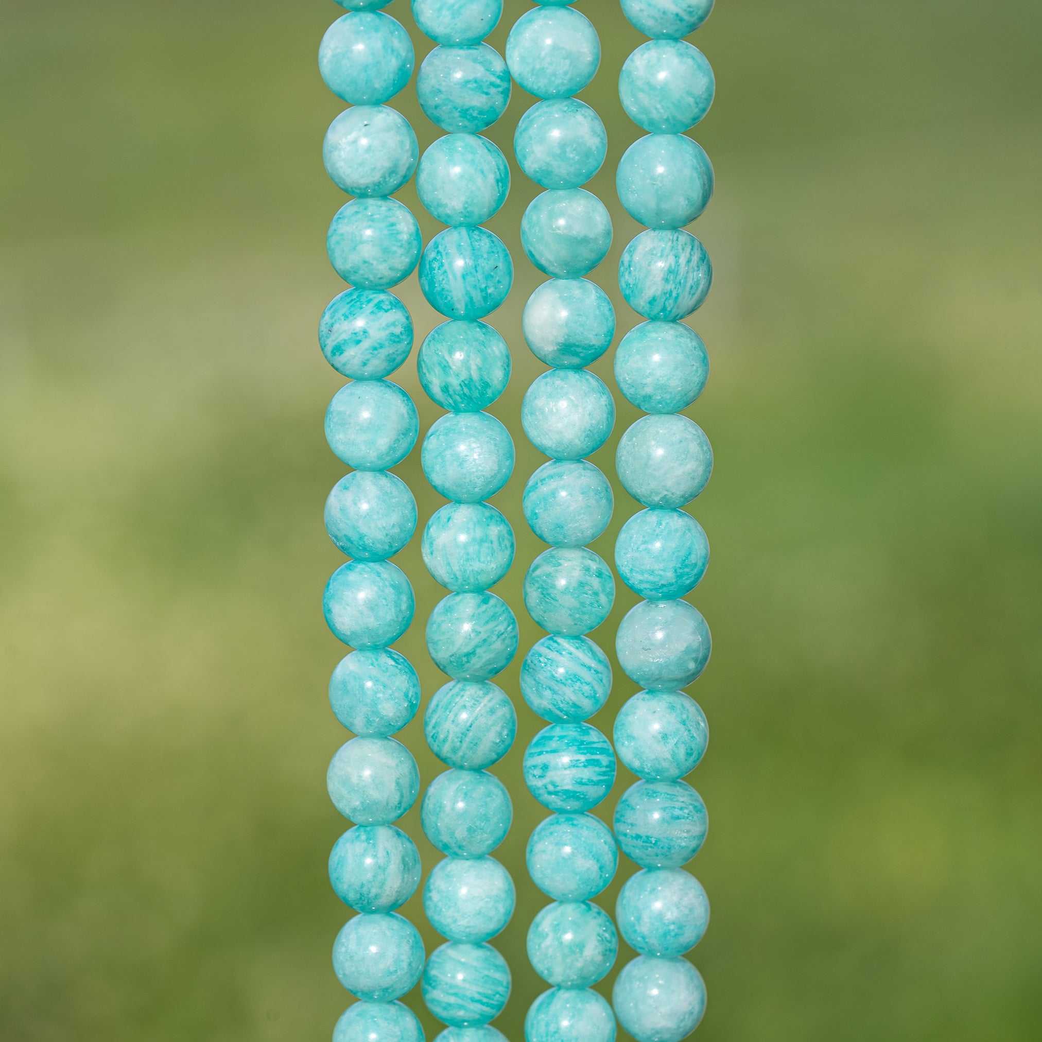 Perles rondes en Amazonite de 8 mm ( 1/2 rang de env 23 perles )