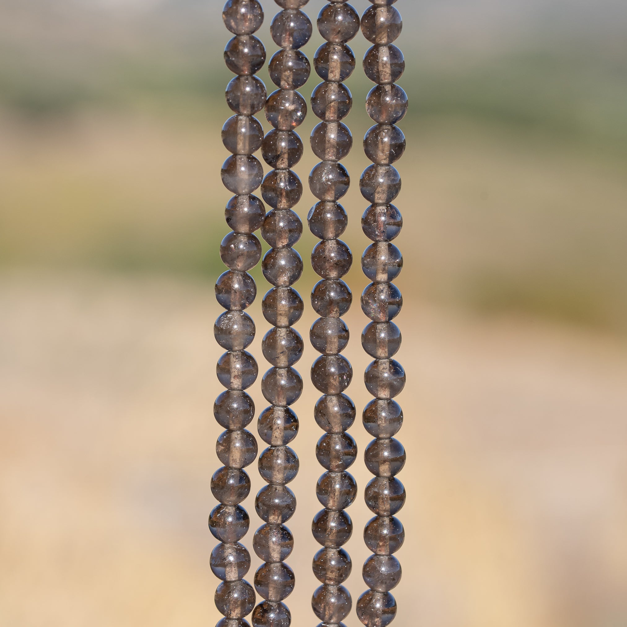 Perles rondes lisses de Quartz fumé de 6,5 mm ( rang de env 60 perles )