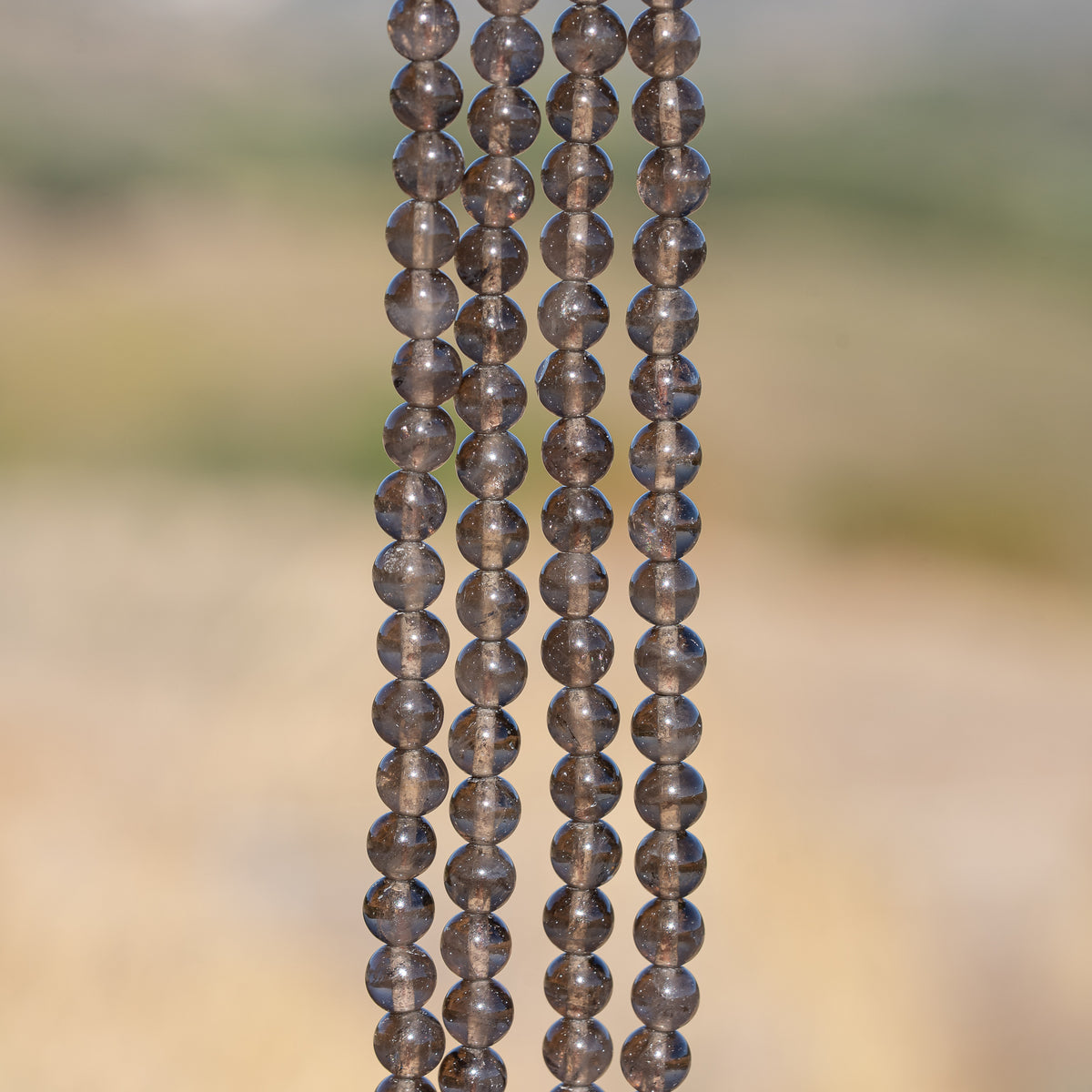 Perles rondes lisses de Quartz fumé de 6,5 mm ( rang de env 60 perles )