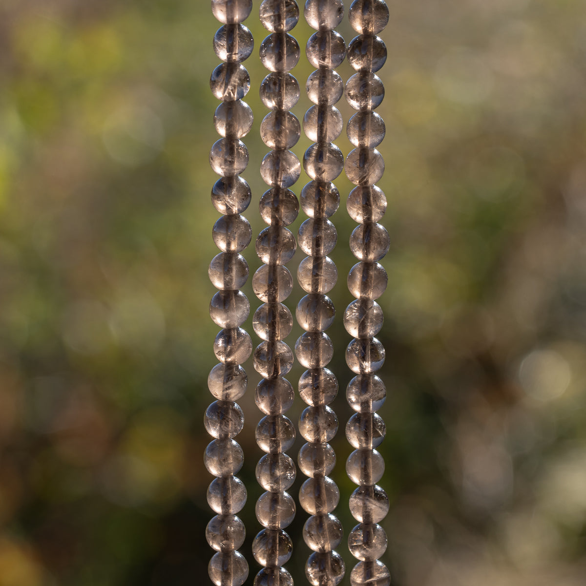 Perles rondes lisses de Quartz fumé de 6,5 mm ( rang de env 60 perles )