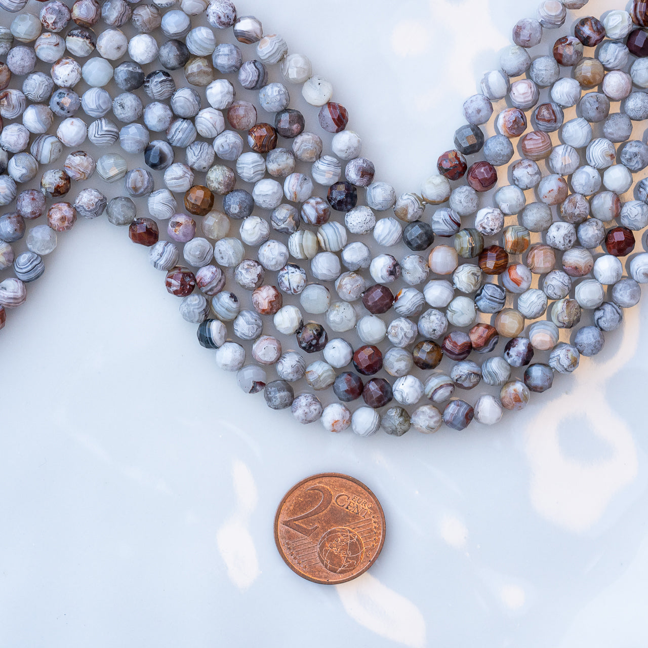 Perles rondes facettes en Agate crazy lace de 5 mm ( rang de env 78 perles )