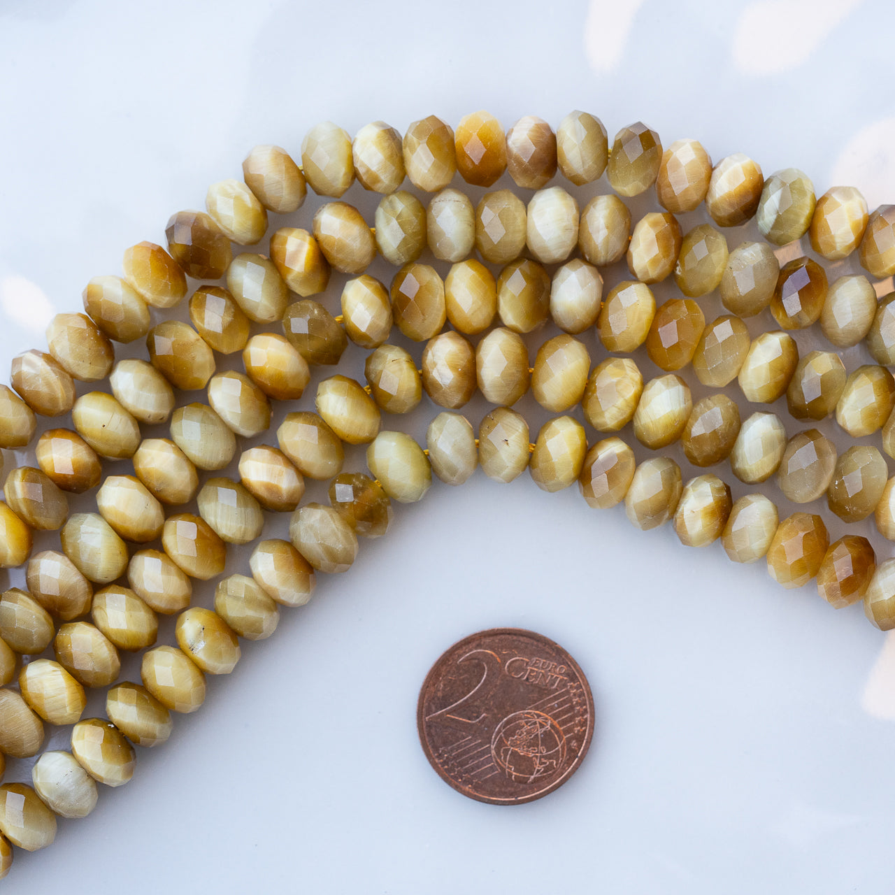 Perles rondelles facettes en Oeil de tigre doré de 8 x 5 mm ( 1/2 rang de env 36 perles )