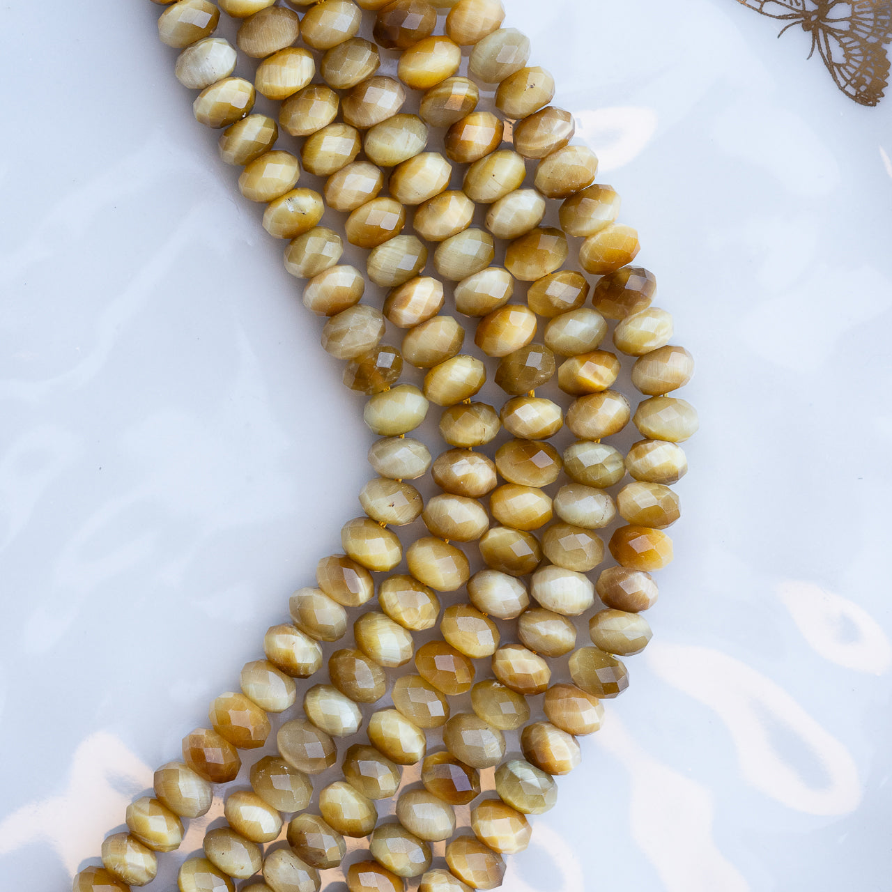 Perles rondelles facettes en Oeil de tigre doré de 8 x 5 mm ( 1/2 rang de env 36 perles )