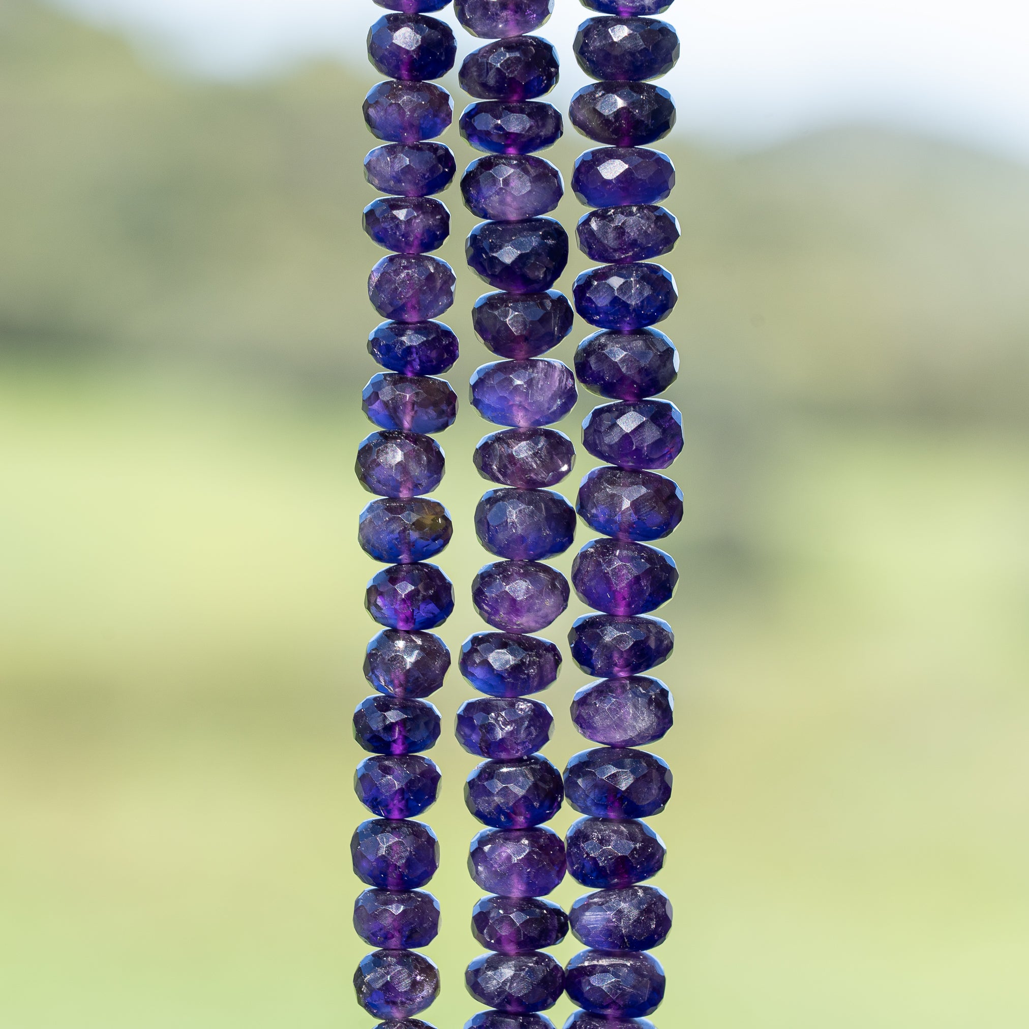 Perles rondelles facettes en Améthyste de 6,5 à 8,5 mm ( lot de 2 )