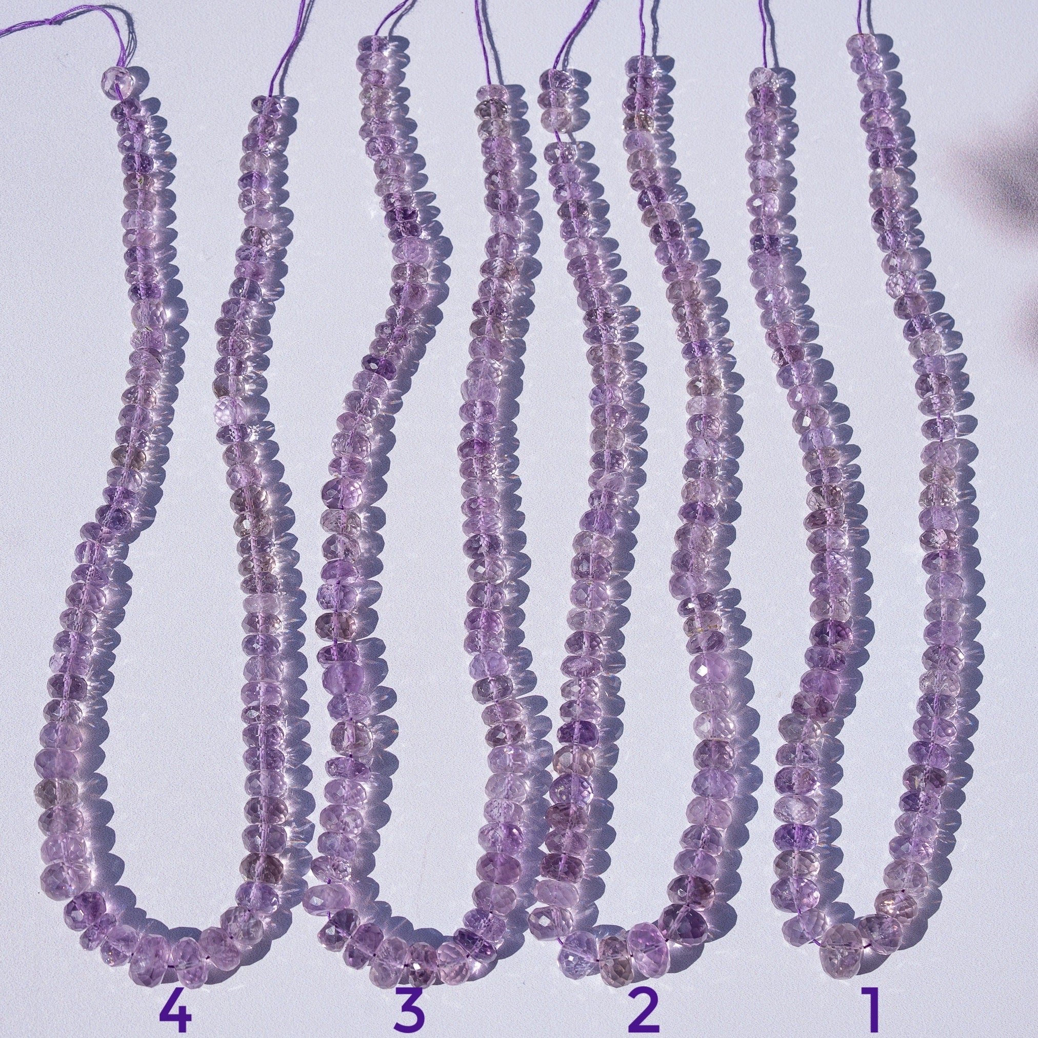 Fil de 39 cm de perles rondelles facettes en Améthyste de env 6/11 x 3,5/9 mm