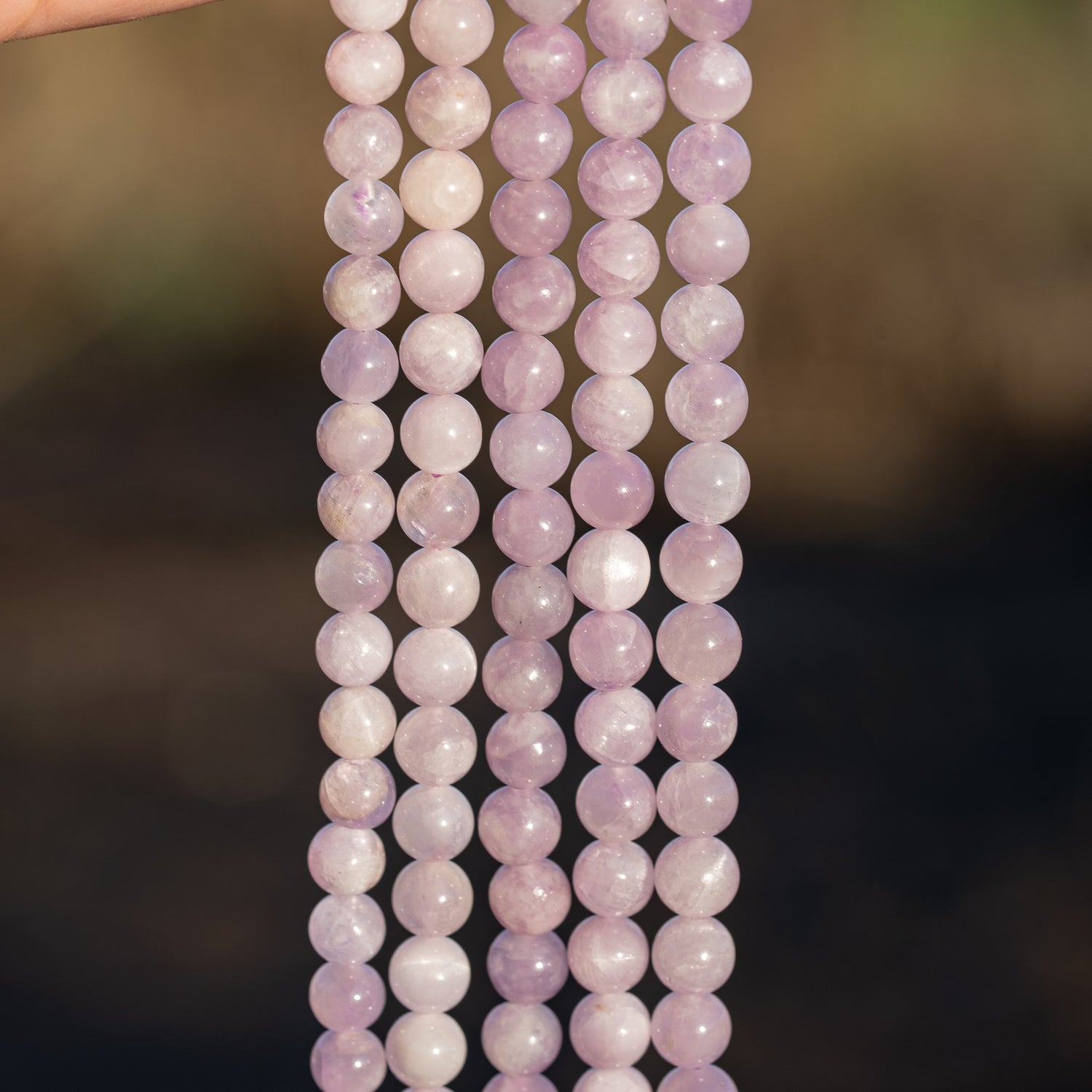 Perles rondes lisses de Kunzite de 6/6,5 mm ( 1/2 rang de env 30/33 perles )