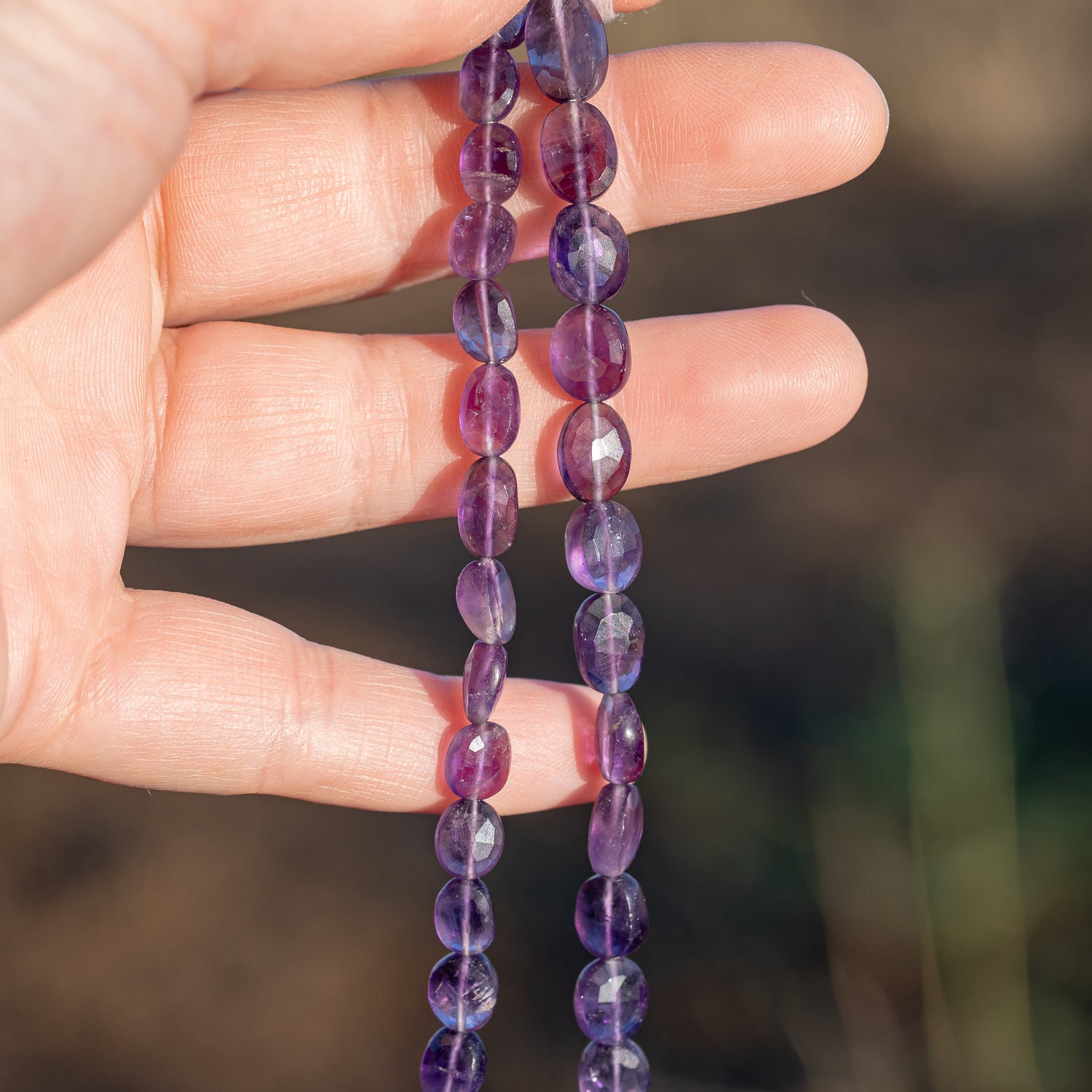 Fils de 31/32 cm de perles ovales facettes en Améthyste de env 7/11 mm