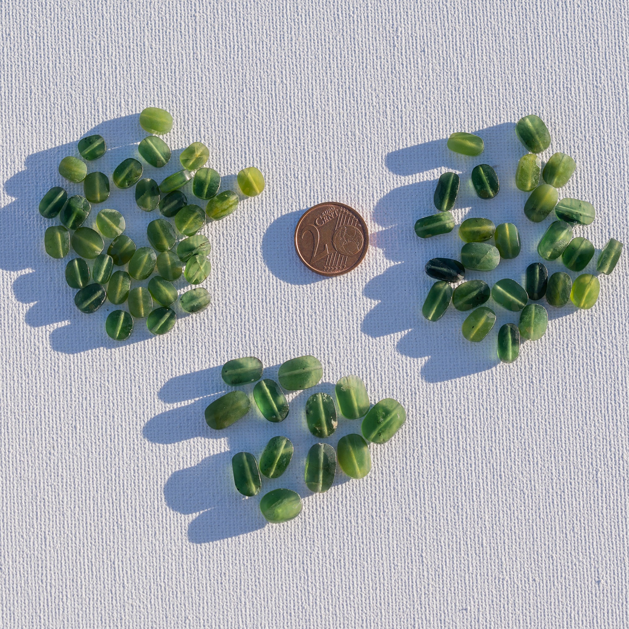 Perles ovales facettes de Serpentine de env 8/10 mm ( lot de 2 )