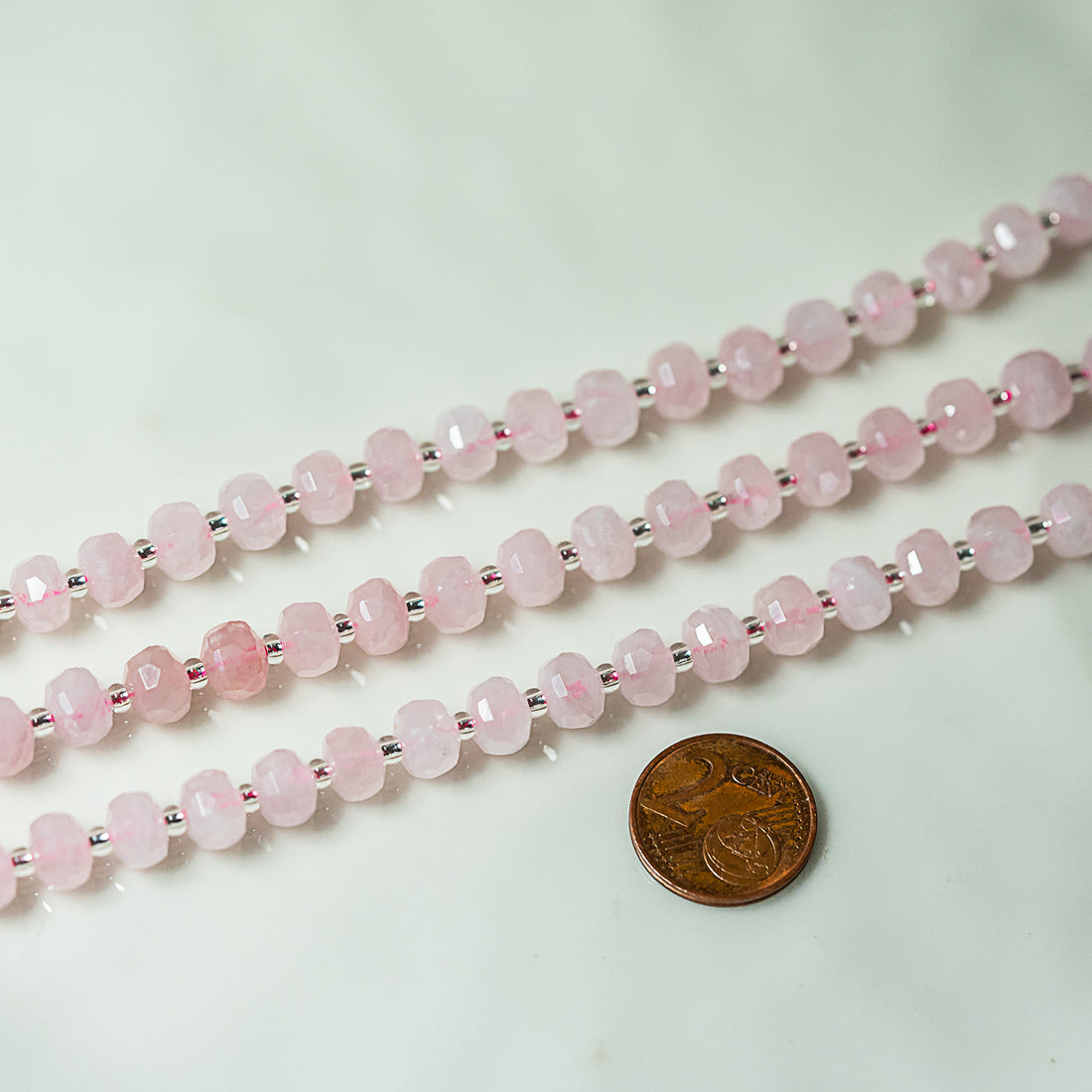 Perles rondelles facettes de Quartz rose de 8 x 5,5 mm ( 1/2 rang de env 24 perles )