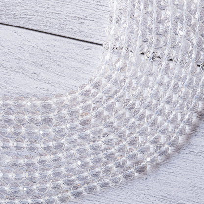 Perles rondes facettes de cristal de roche de 6 mm ( rang de env 63 perles )