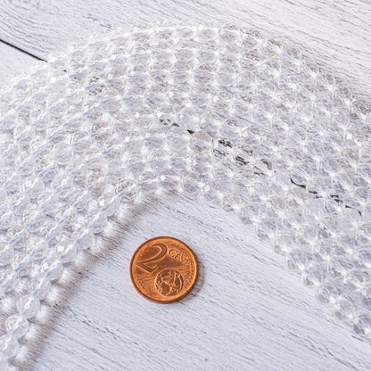 Perles rondes facettes de cristal de roche de 6 mm ( rang de env 63 perles )