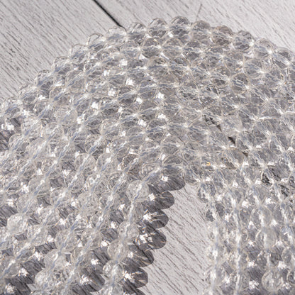Perles rondes facettes de cristal de roche de 6 mm ( rang de env 63 perles )