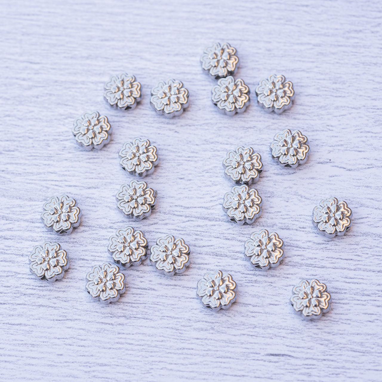 Perles fleurs en acier inoxydable de 8 x 4 mm ( à l&