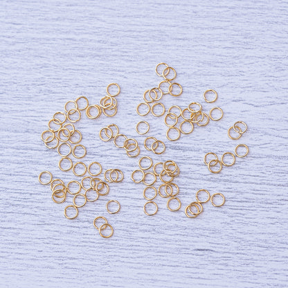 Anneaux de jonction fins en acier inox plaqués or de 4 x 0,5 ou 0,6 mm au choix ( lot de 10 )