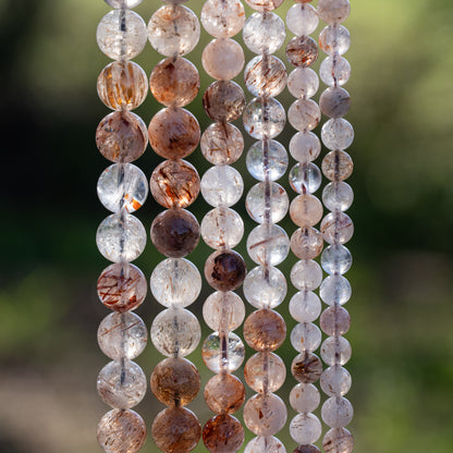 Perles rondes lisses de Quartz à inclusions de Rutile rouge de 10 mm ( 1/2 rang )