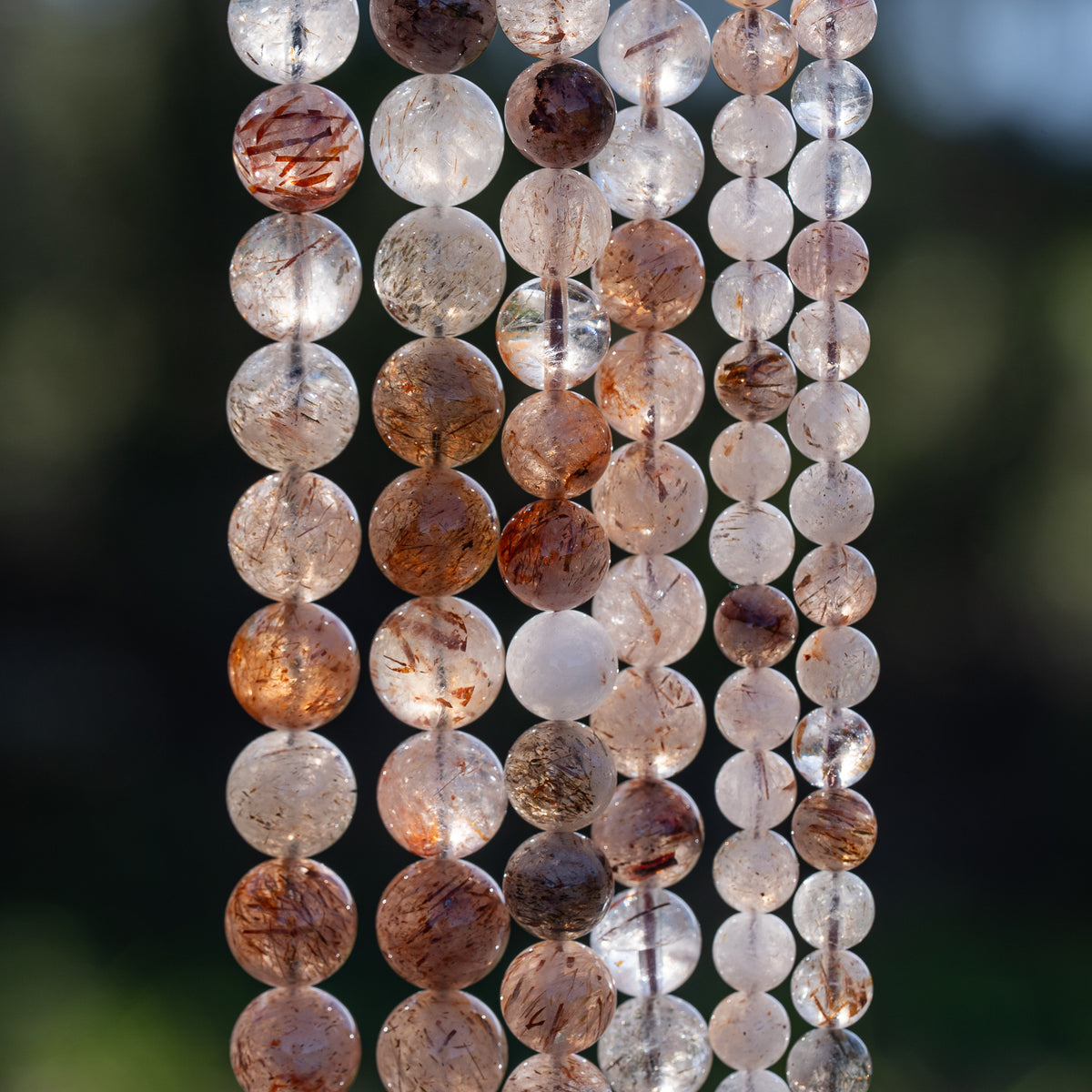 Perles rondes lisses de Quartz à inclusions de Rutile rouge de 10 mm ( 1/2 rang )