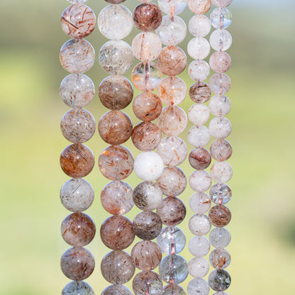 Perles rondes lisses de Quartz à inclusions de Rutile rouge de 10 mm ( 1/2 rang )