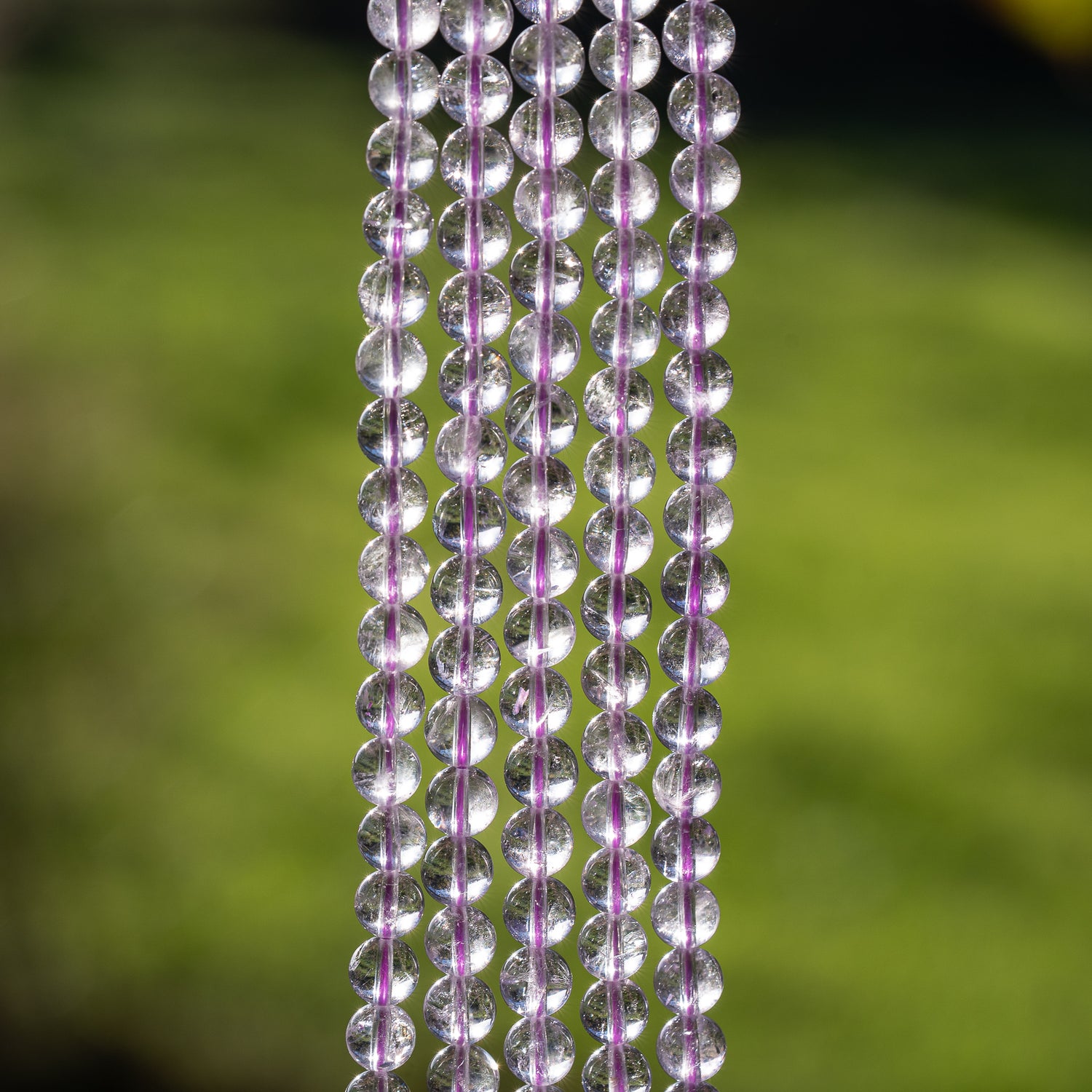 Perles rondes lisses en Améthyste lilas grade A de 6,5 mm ( 1/2 rang de env 30 perles )