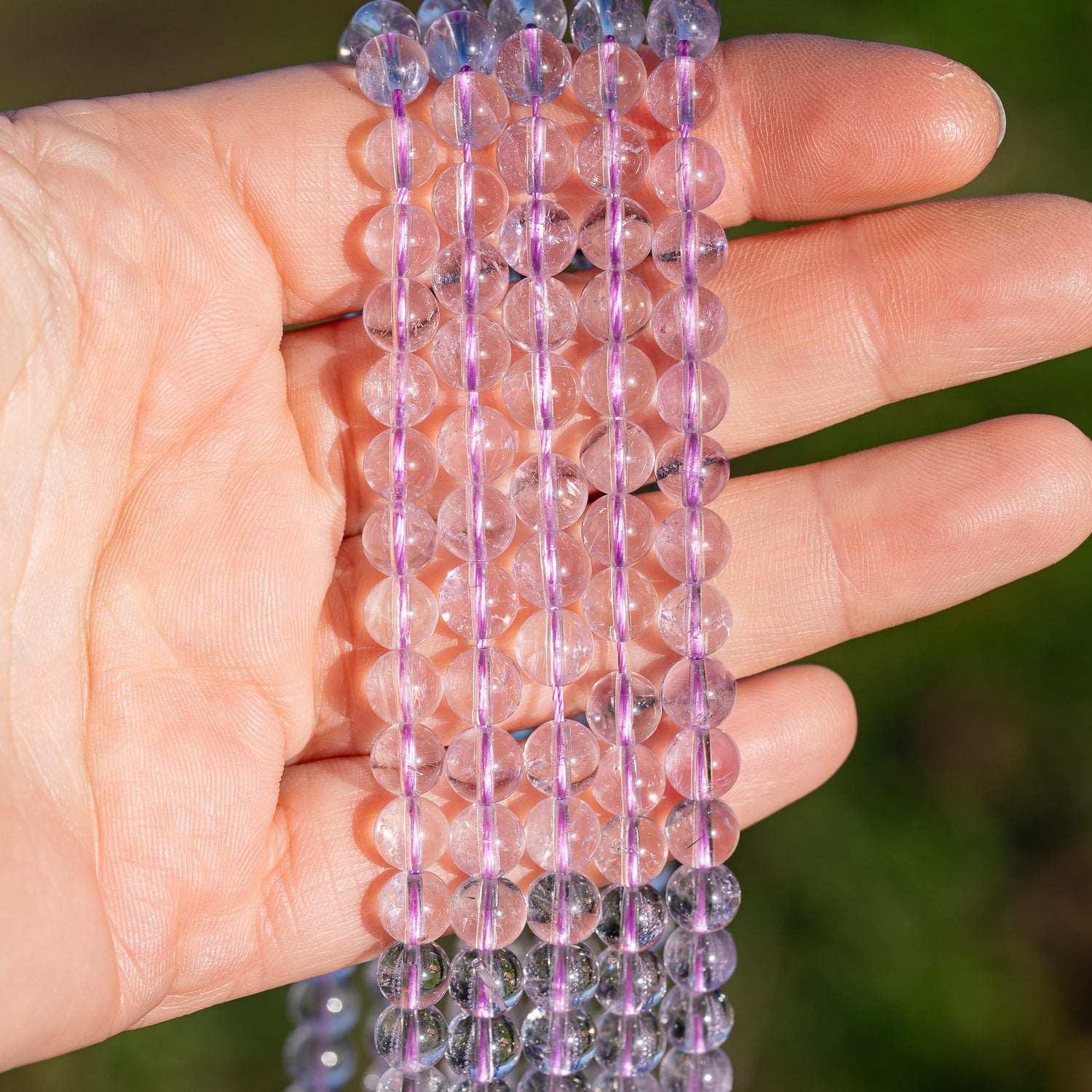 Perles rondes lisses en Améthyste lilas grade A de 6,5 mm ( 1/2 rang de env 30 perles )