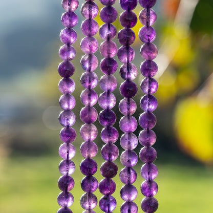 Perles rondes lisses en Améthyste de 8,5 mm ( rang de env 46 perles )