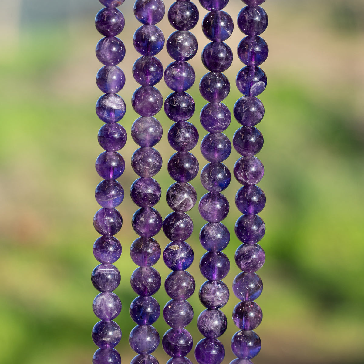 Perles rondes lisses en Améthyste de 8,5 mm ( rang de env 46 perles )