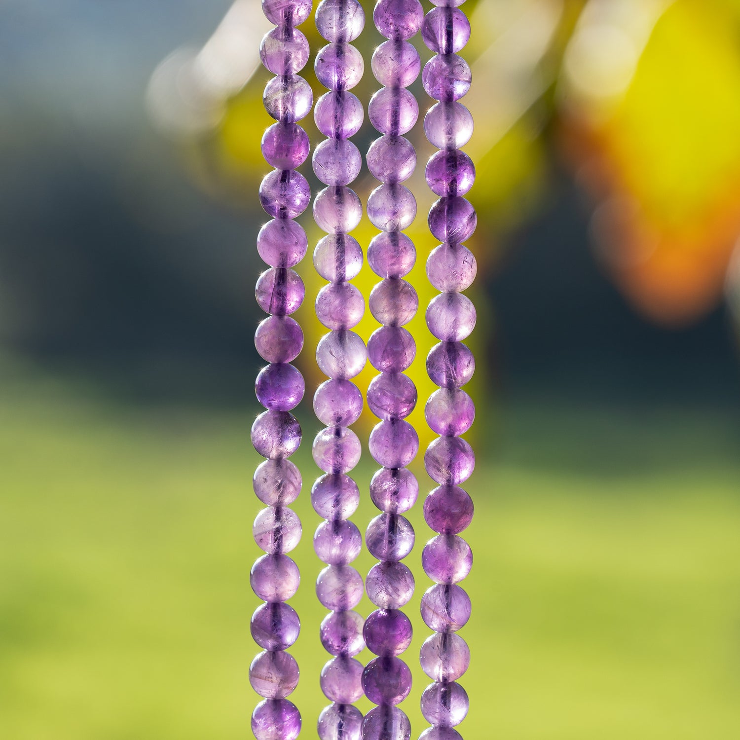 Perles rondes lisses en Améthyste de 6,5 mm ( 1/2 rang de env 30 perles )