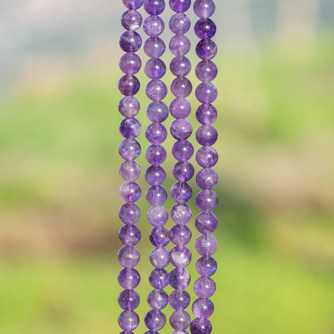 Perles rondes lisses en Améthyste de 6,5 mm ( 1/2 rang de env 30 perles )