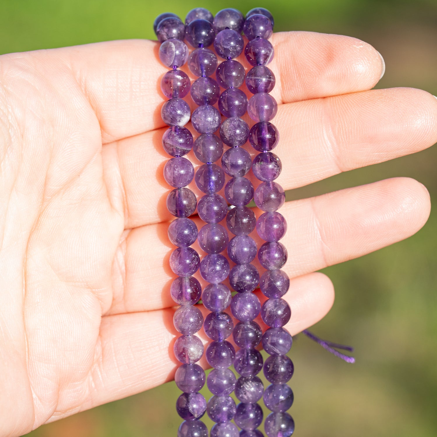 Perles rondes lisses en Améthyste de 6,5 mm ( 1/2 rang de env 30 perles )