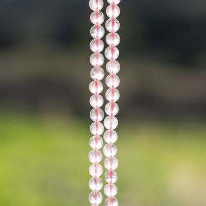Perles rondes lisses de Quartz rose de 6,5 mm ( 1/2 rang de env 29 perles )