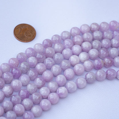 Perles rondes lisses de Kunzite grade A+ de 8 mm ( 1/4 rang de env 11/12 perles )