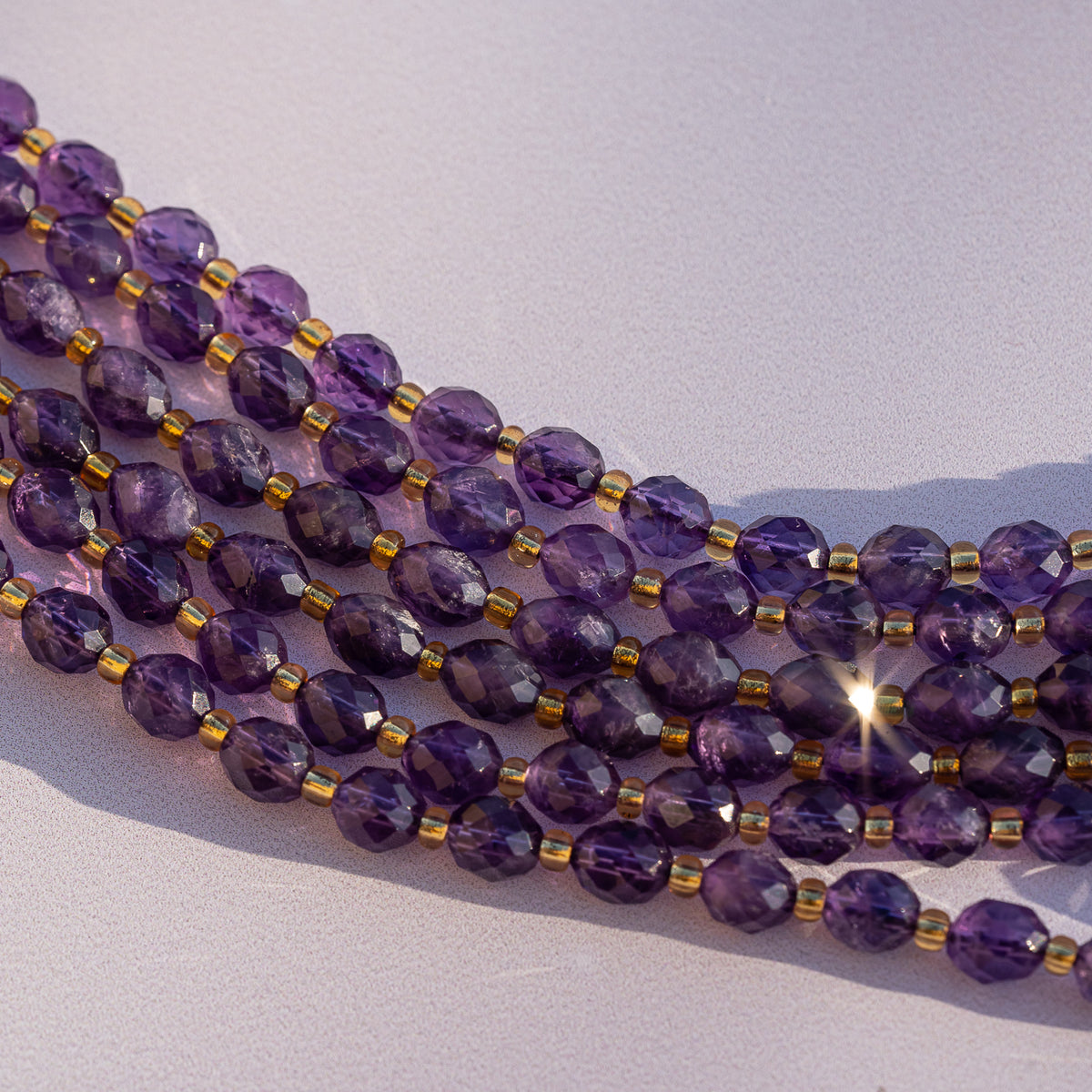 Perles ovales facettes en Améthyste de 7/8 mm ( rang ou 1/2 rang )