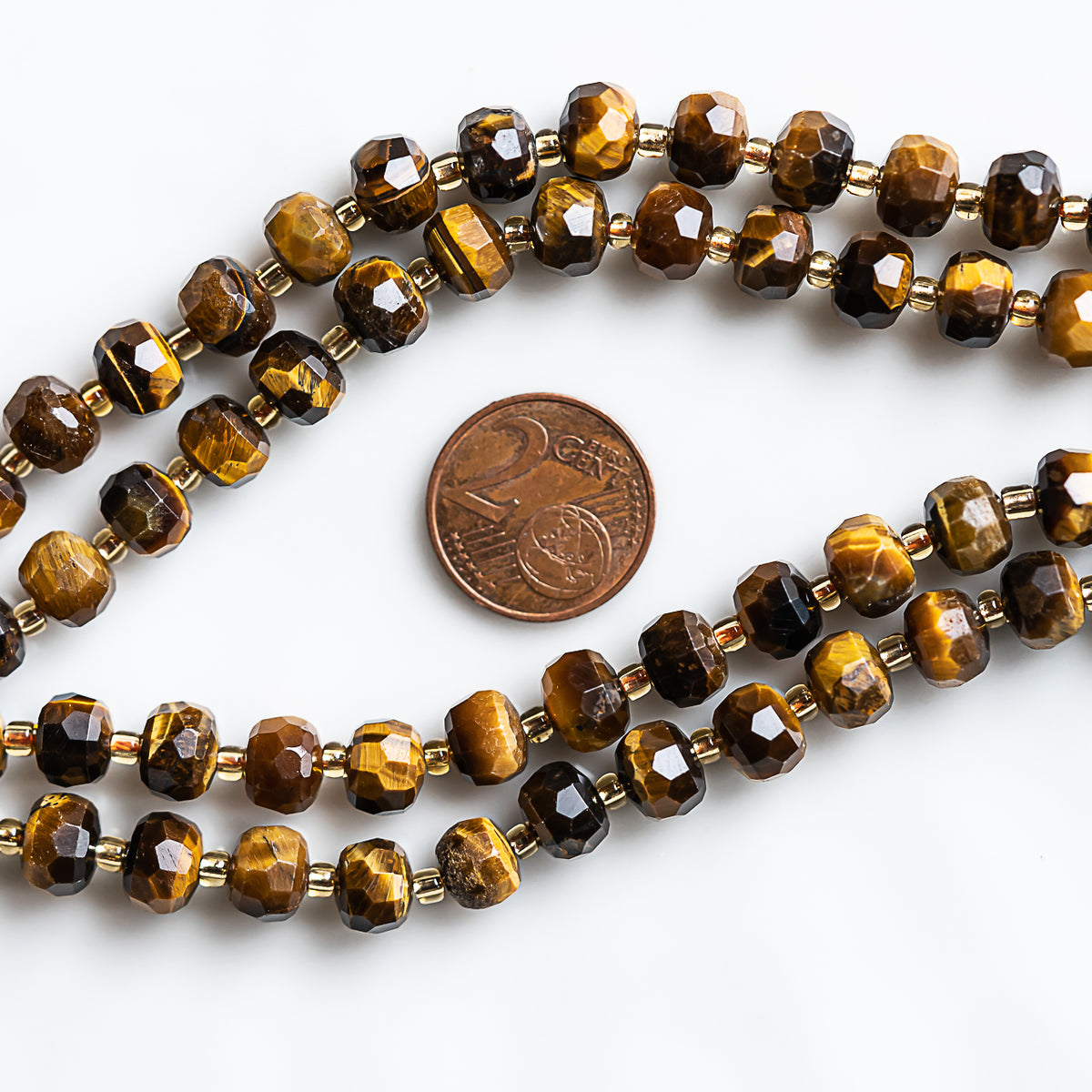 Perles rondelles facettes en Oeil de Tigre de 7/8 x 5,5/6 mm ( rang de env 45 perles )