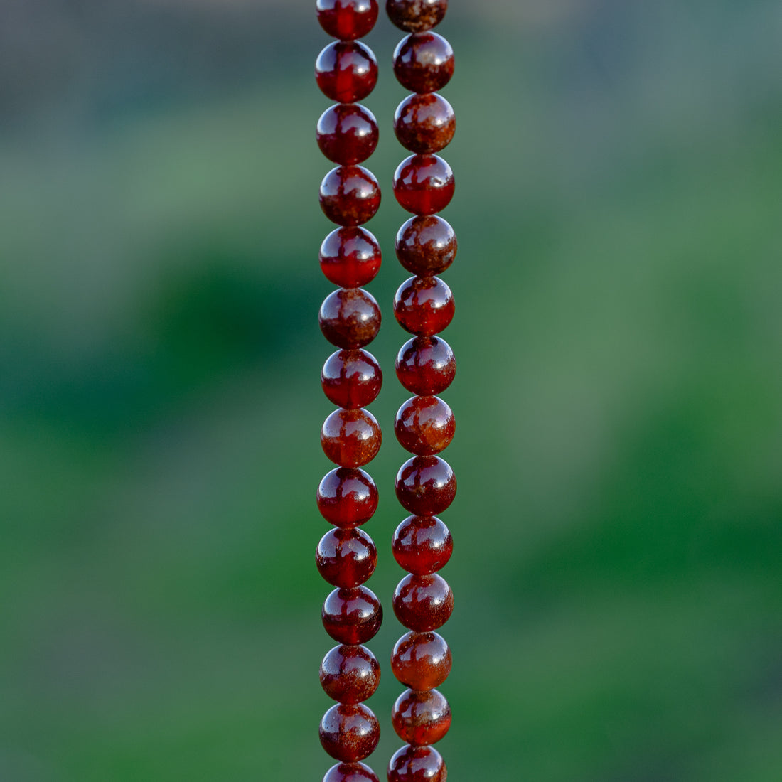 Perles rondes lisses de Grenat orange de 8 mm ( 1/2 rang de env 24 perles )