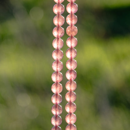 Perles rondes lisses de Quartz fraise de 8,5 mm ( 1/2 rang de env 23 perles )