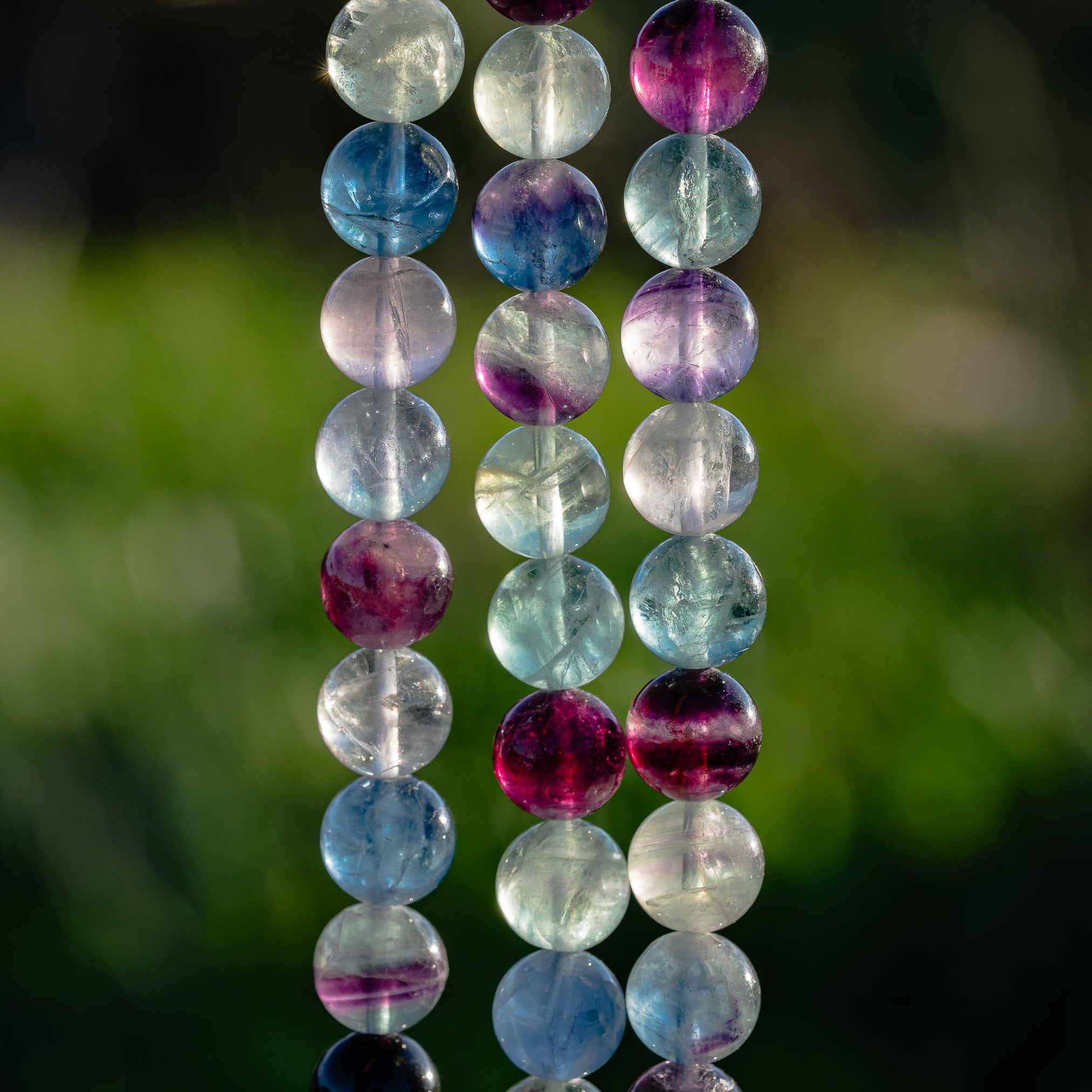 Perles rondes de Fluorite multicolore de 12 mm ( 1/2 rang de env 16 perles )