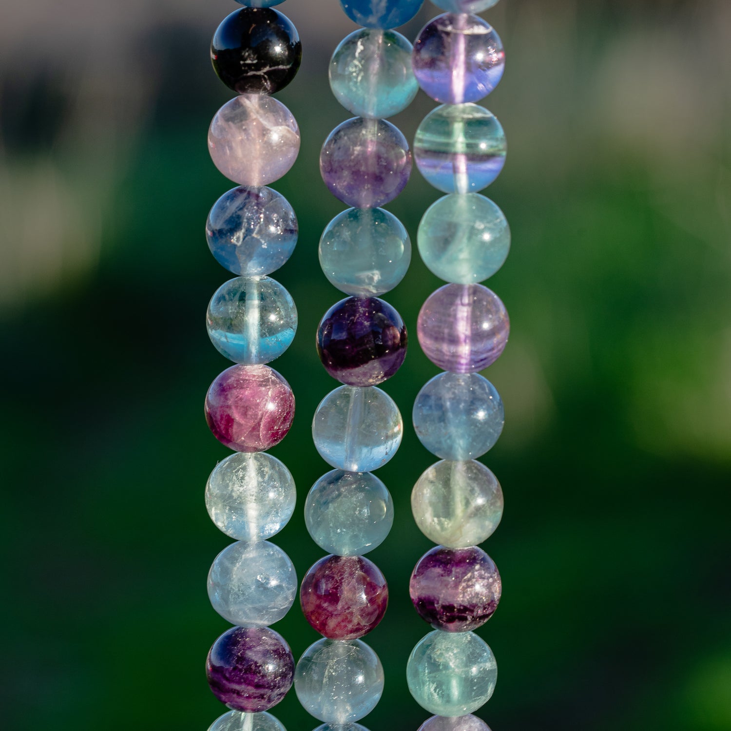 Perles rondes de Fluorite multicolore de 12 mm ( 1/2 rang de env 16 perles )