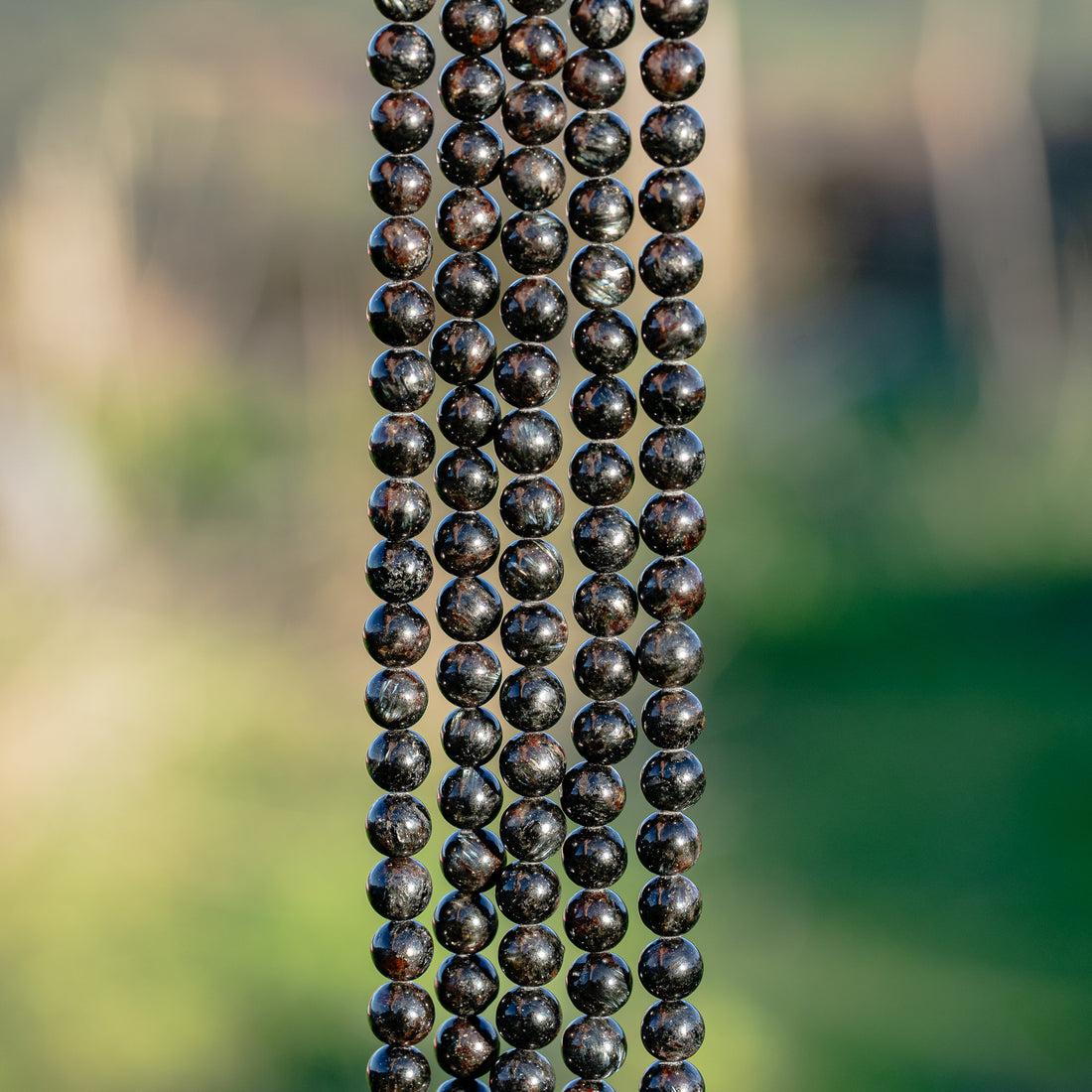 Perles rondes lisse en Arfvedsonite de 6 mm ( 1/2 rang ou rang )