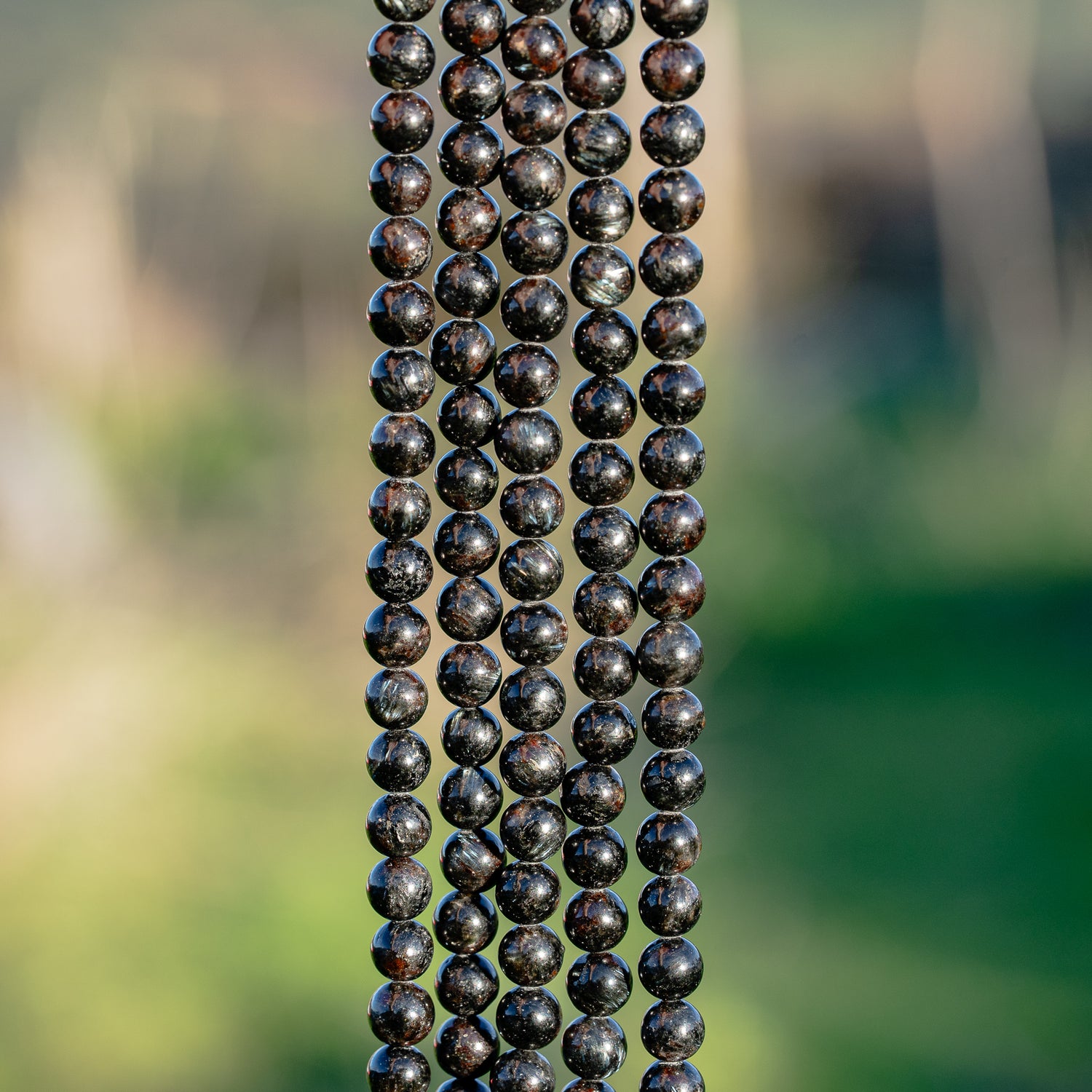 Perles rondes lisse en Arfvedsonite de 6 mm ( 1/2 rang ou rang )