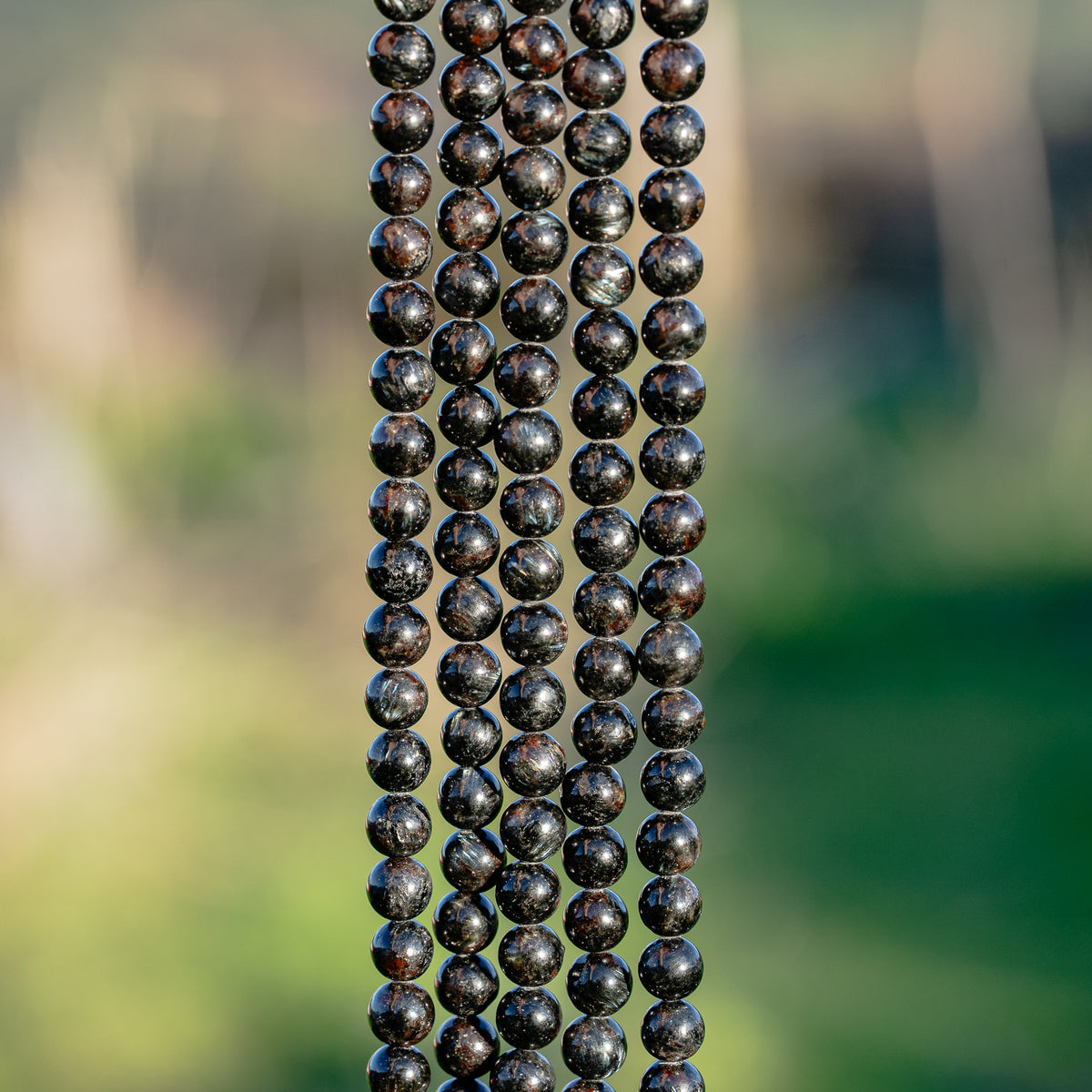 Perles rondes lisse en Arfvedsonite de 6 mm ( 1/2 rang ou rang )