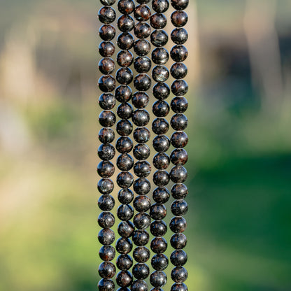 Perles rondes lisse en Arfvedsonite de 6 mm ( 1/2 rang ou rang )