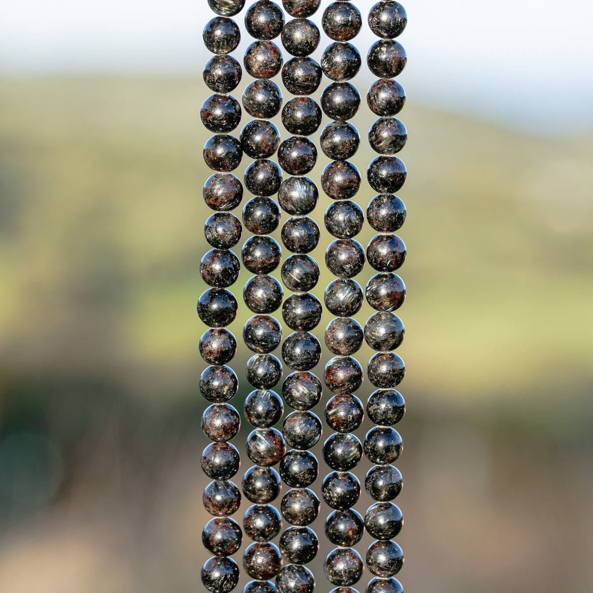 Perles rondes lisse en Arfvedsonite de 6 mm ( 1/2 rang ou rang )