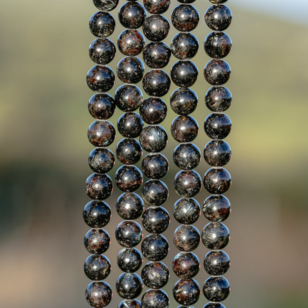 Perles rondes lisse en Arfvedsonite de 6 mm ( 1/2 rang ou rang )