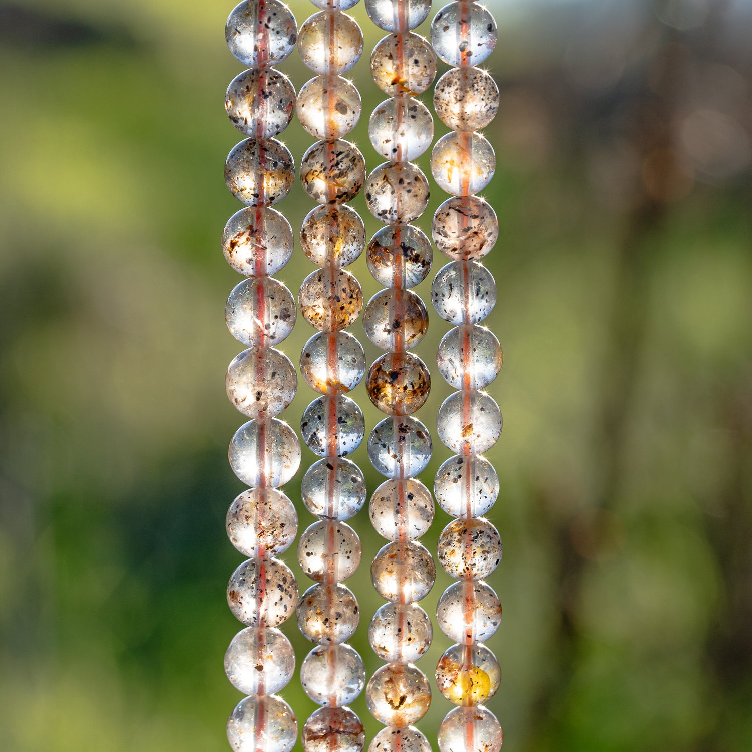 Perles rondes lisses de Quartz à inclusions de 8/8,5 mm ( 1/2 rang de env 22/24 perles )