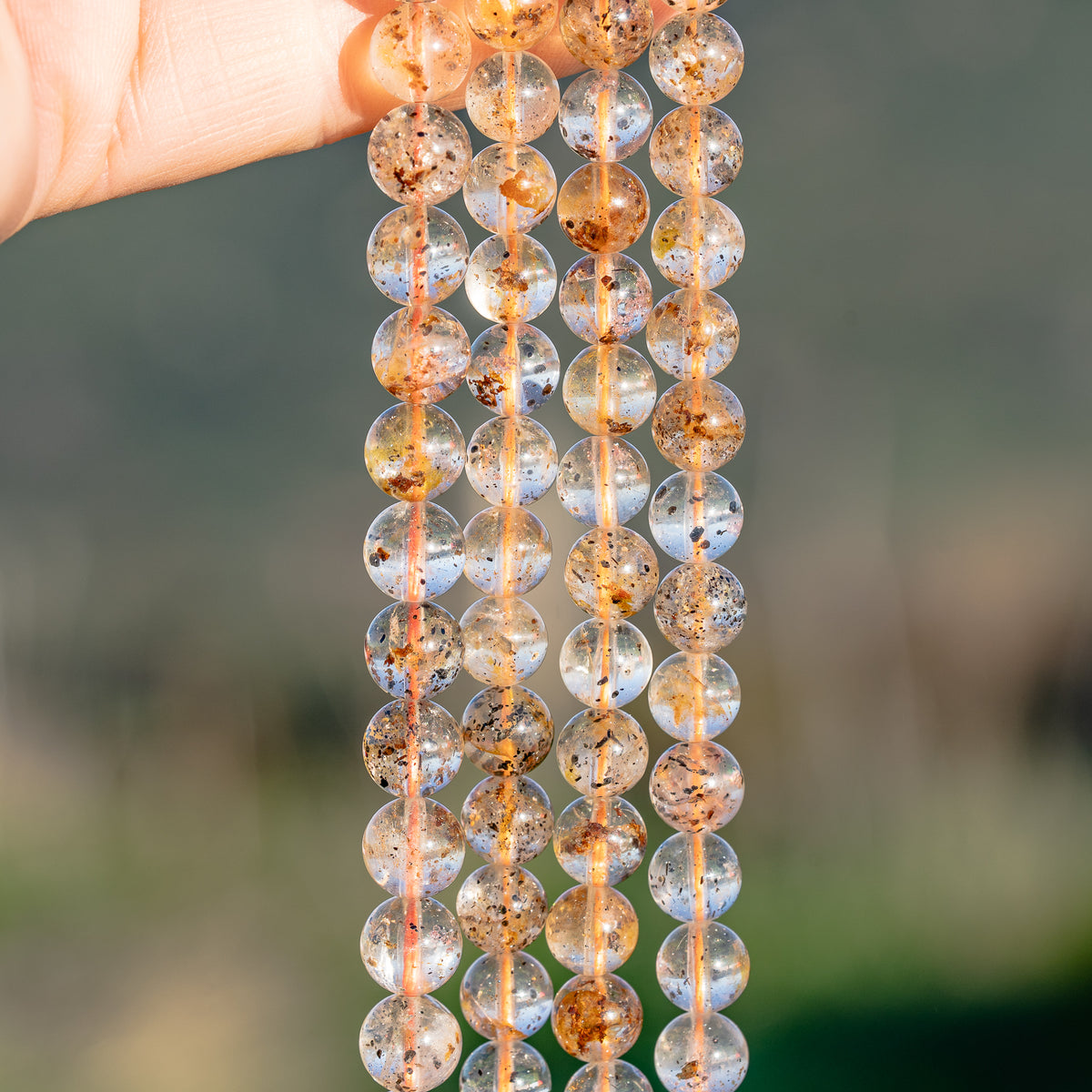 Perles rondes lisses de Quartz à inclusions de 8/8,5 mm ( 1/2 rang de env 22/24 perles )