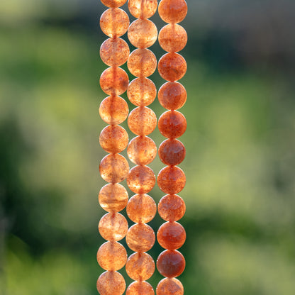 Perles rondes lisses de Pierre de soleil grade A de 8 ou 8,5 mm ( lot de 10 perle ou par 1/2 rang )