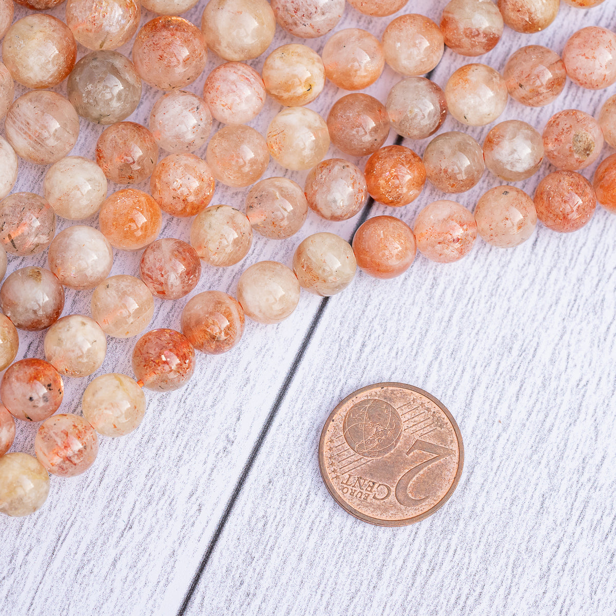 Perles rondes lisses de Pierre de soleil de 8 ou 10 mm ( 1/2 rang de env 24 perles ou 20 perles )