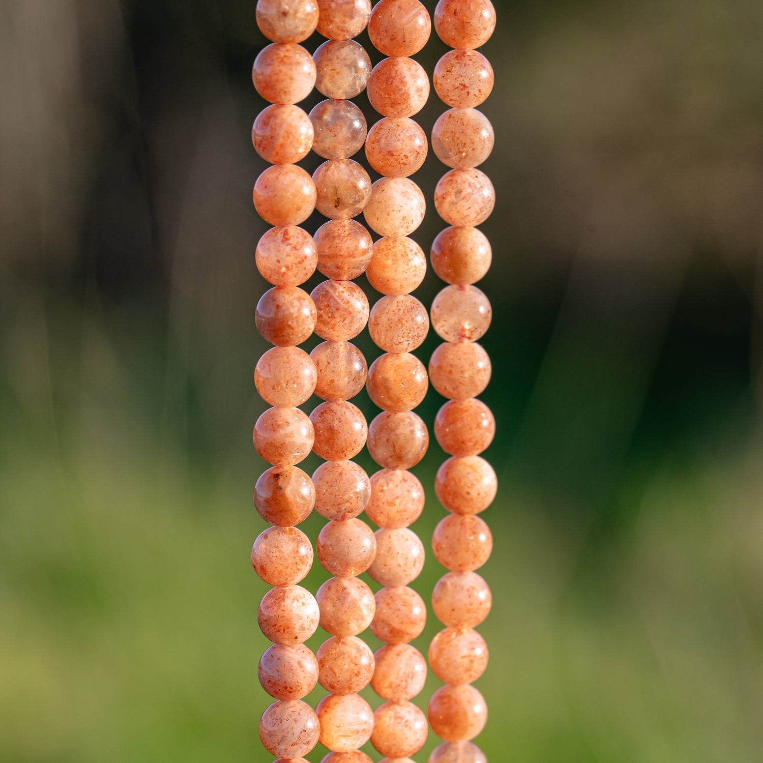 Perles rondes lisses de Pierre de Soleil de 6 mm ( rang de env 62 perles )