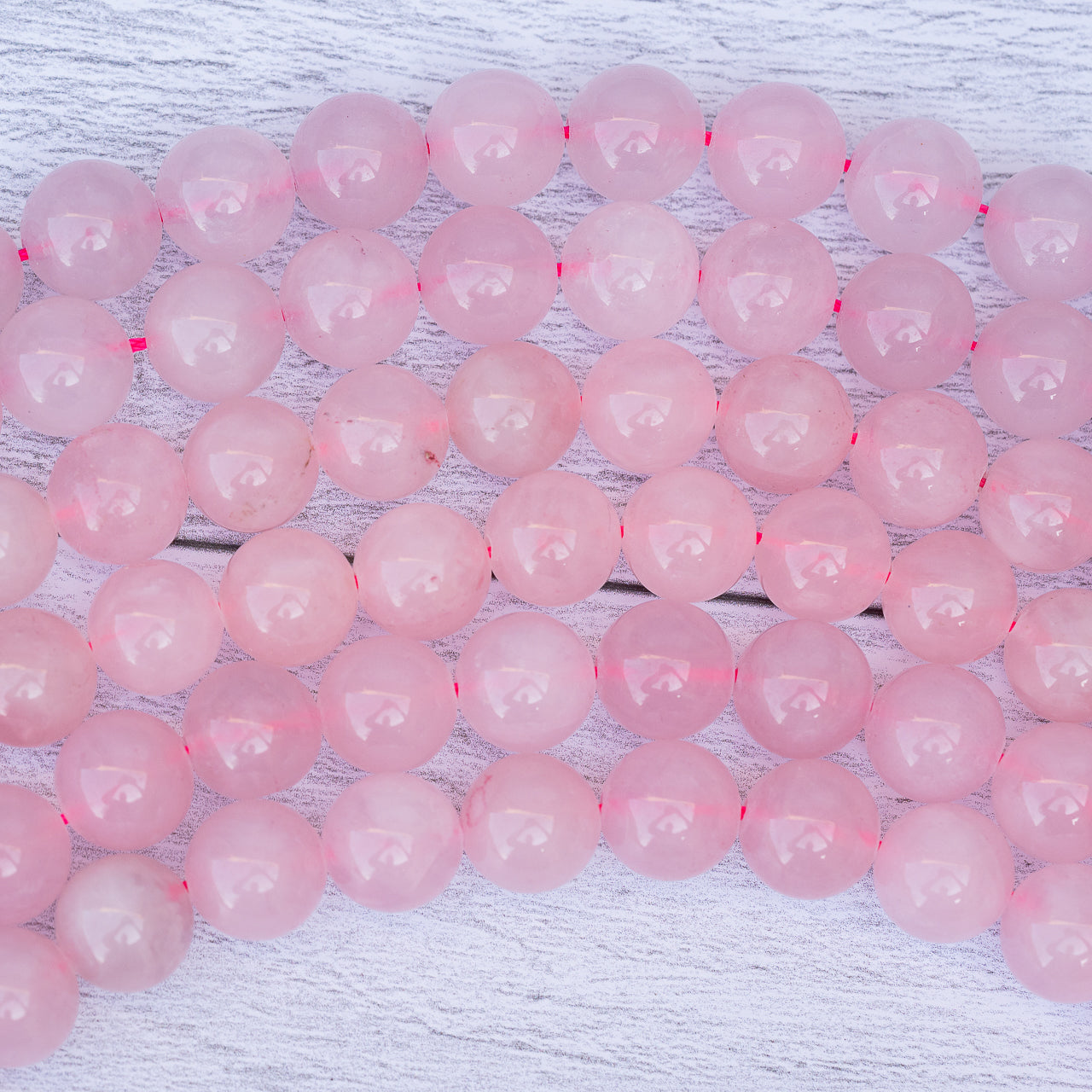 Perles rondes lisses de Quartz rose de 12 mm ( 1/2 rang de env 16 perles )