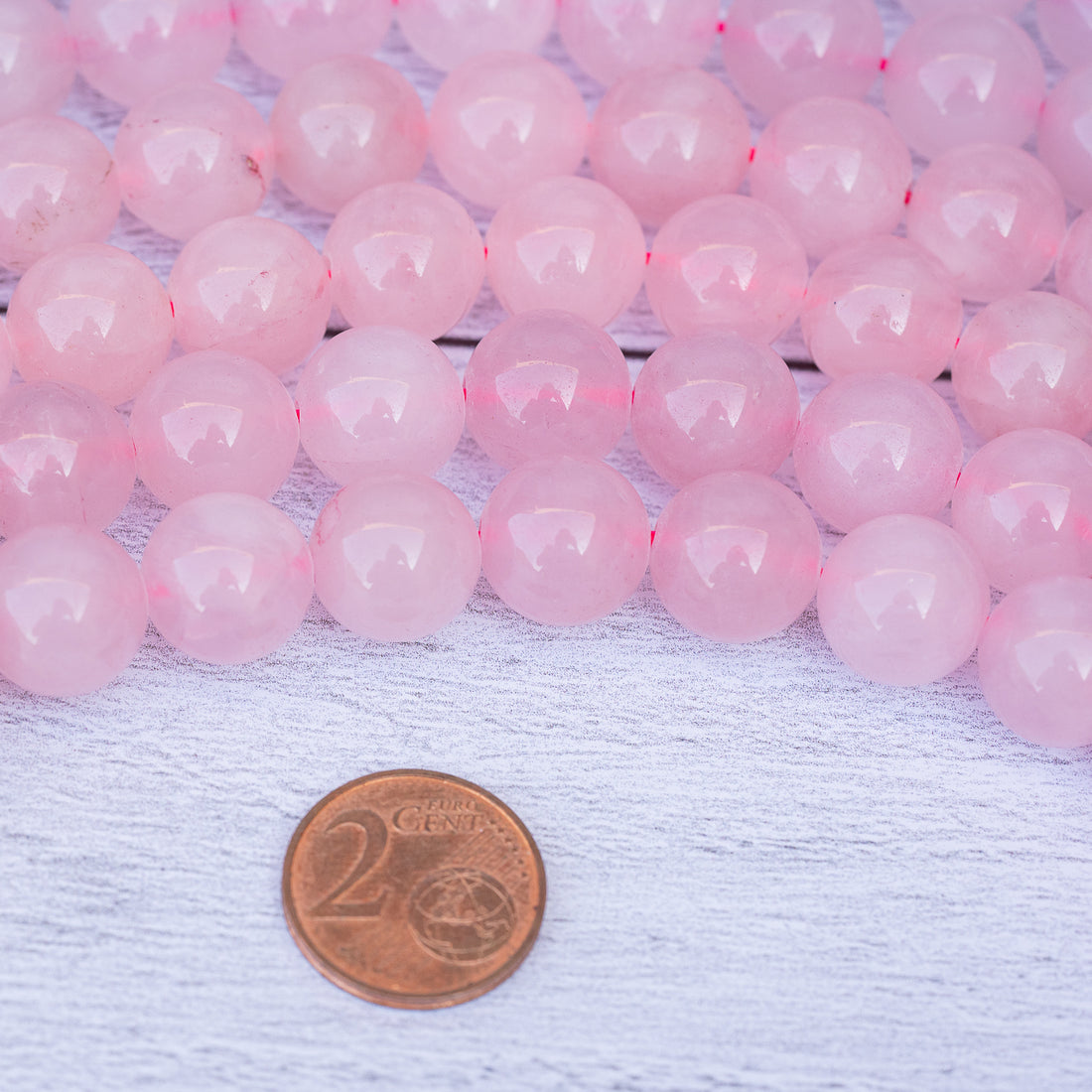 Perles rondes lisses de Quartz rose de 12 mm ( 1/2 rang de env 16 perles )