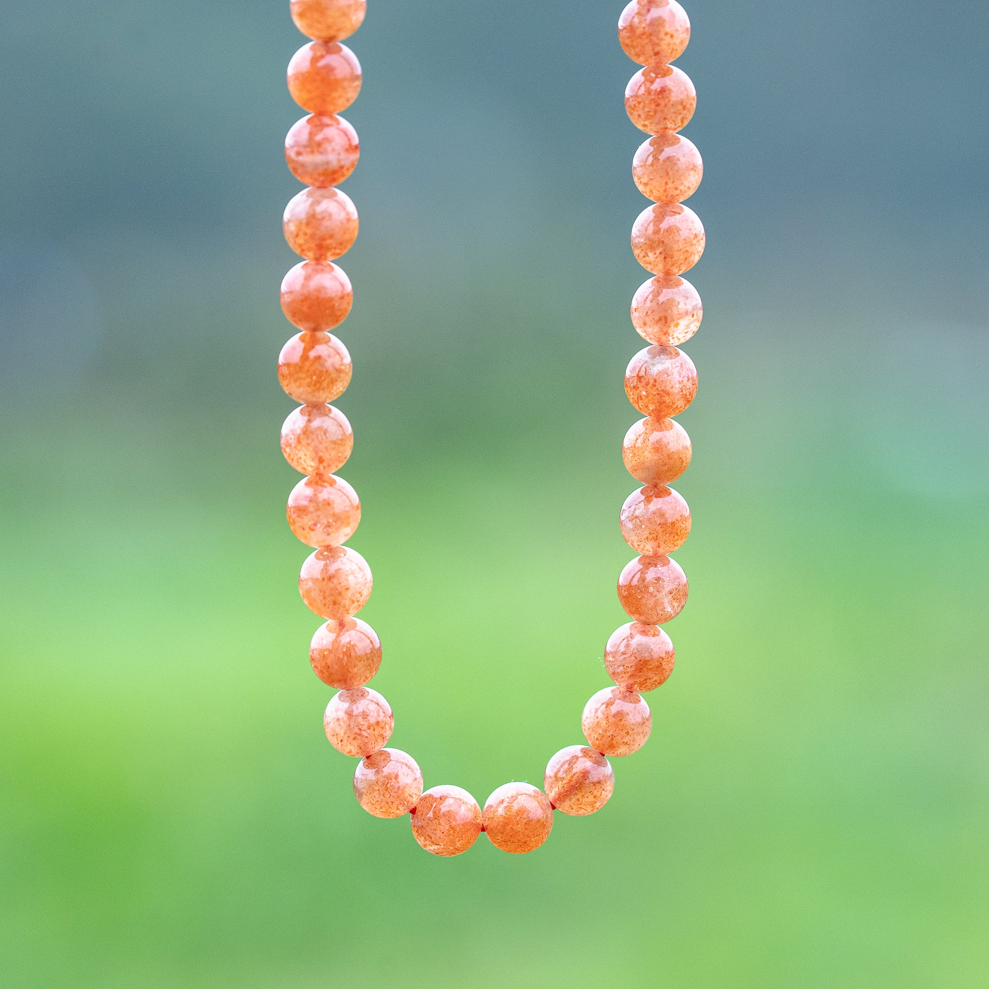 Perles rondes lisses de Pierre de soleil extra de 7 mm ( lot de 6 perles ou 1/2 rang )